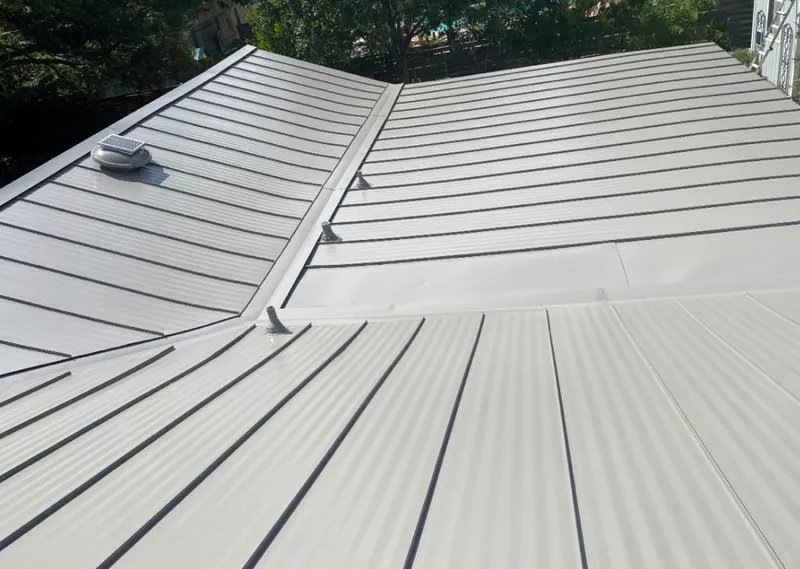 Solar attic fan installed on a metal roof for Roof Ventilation in Peekskill